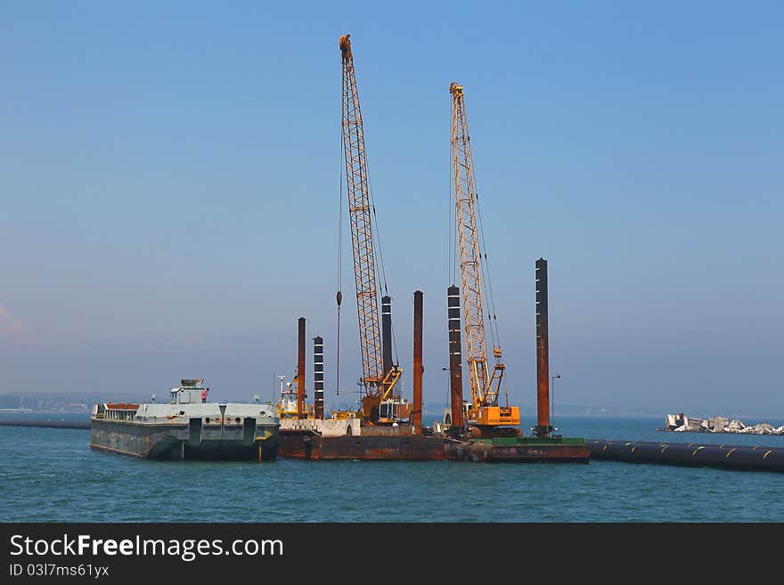 Pontoon dock with cargo cranes