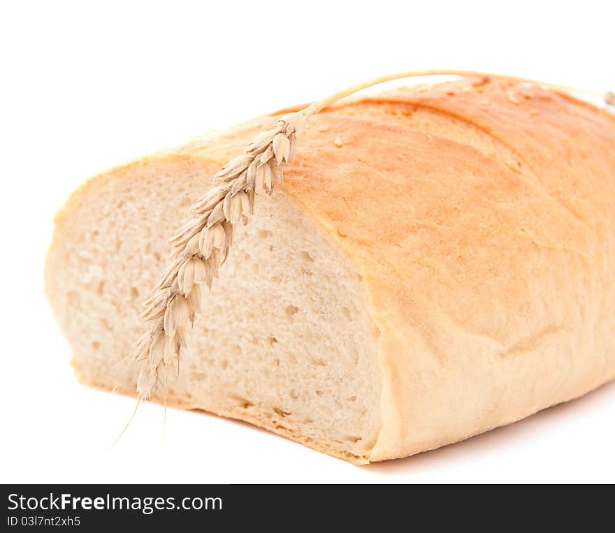 Spikelet wheat bread over white background