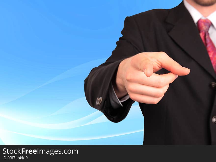 Businessman pointing on soft background. Businessman pointing on soft background