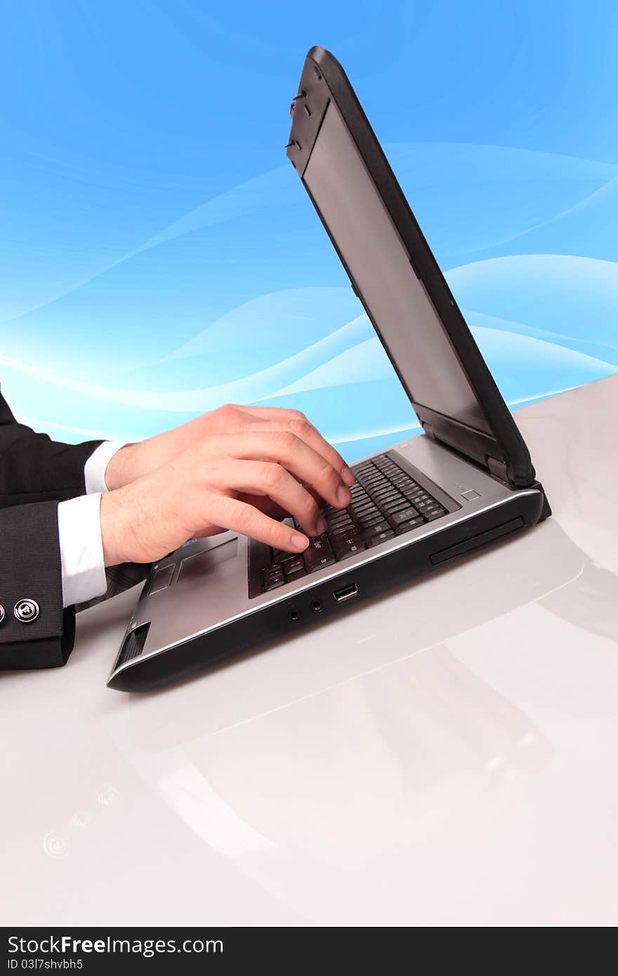 Businessman typing on laptop with binary code on background. Businessman typing on laptop with binary code on background