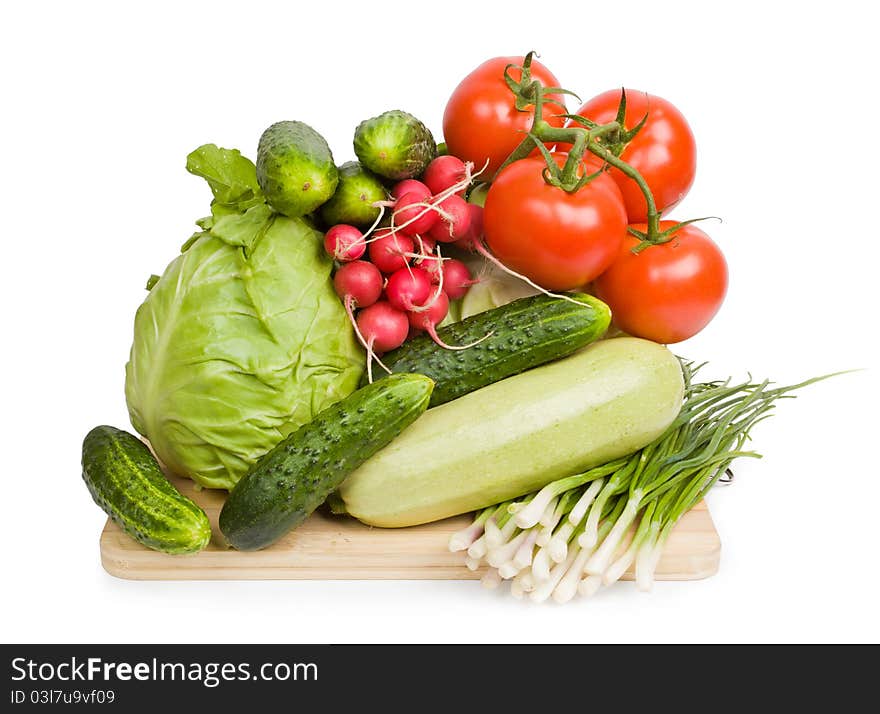 Vegetables on wooden chopping board