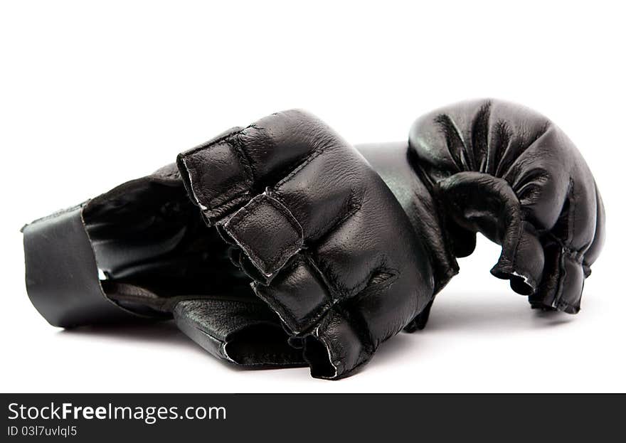 Black boxing gloves on white background