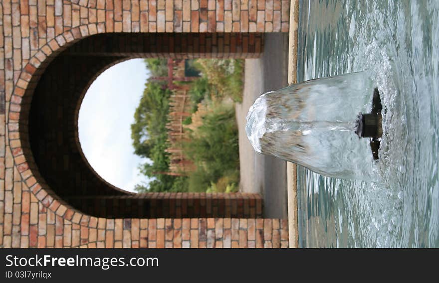 Water fountain with Brick Arch in Background. Water fountain with Brick Arch in Background