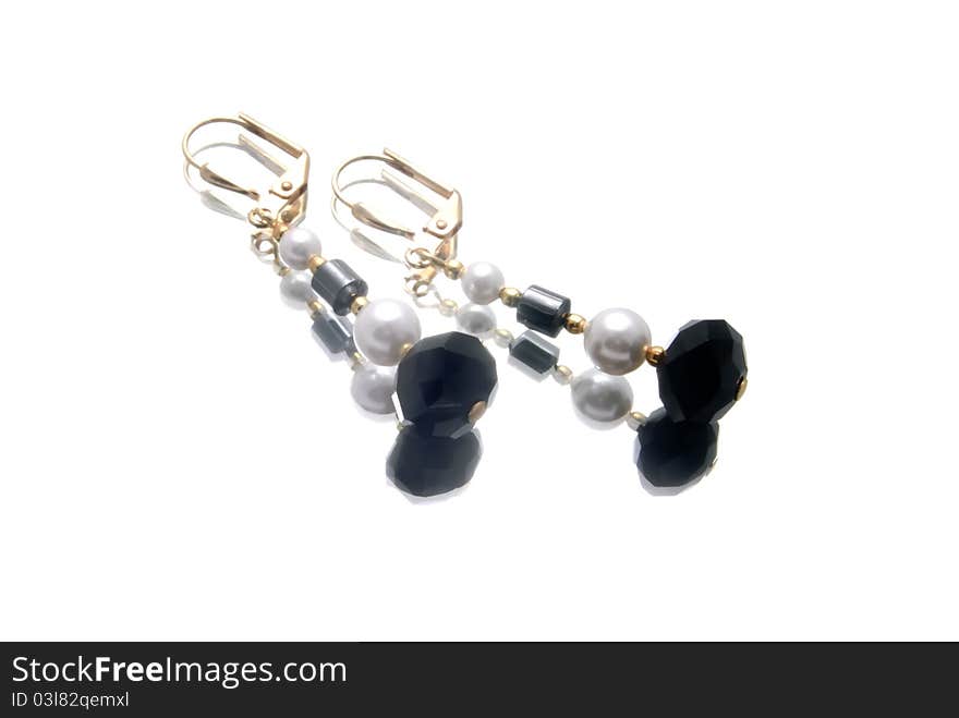 Handmade earrings with gemstones, isolated over white, close up, brightly lit, nobody, two objects, group of objects