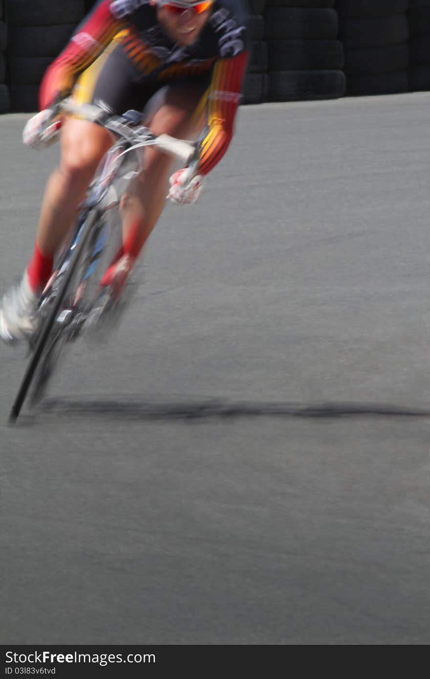 Blurred motion cyclist in a corner. Blurred motion cyclist in a corner