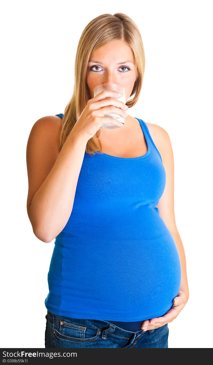 Pregnant woman with glass of milk isolated on white