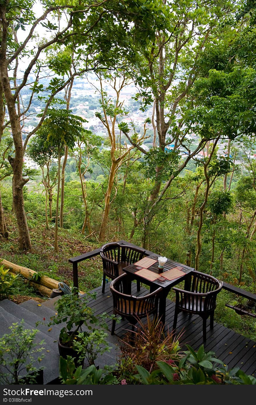 Reclusive cafe table on the terrace in tropical woods. Reclusive cafe table on the terrace in tropical woods