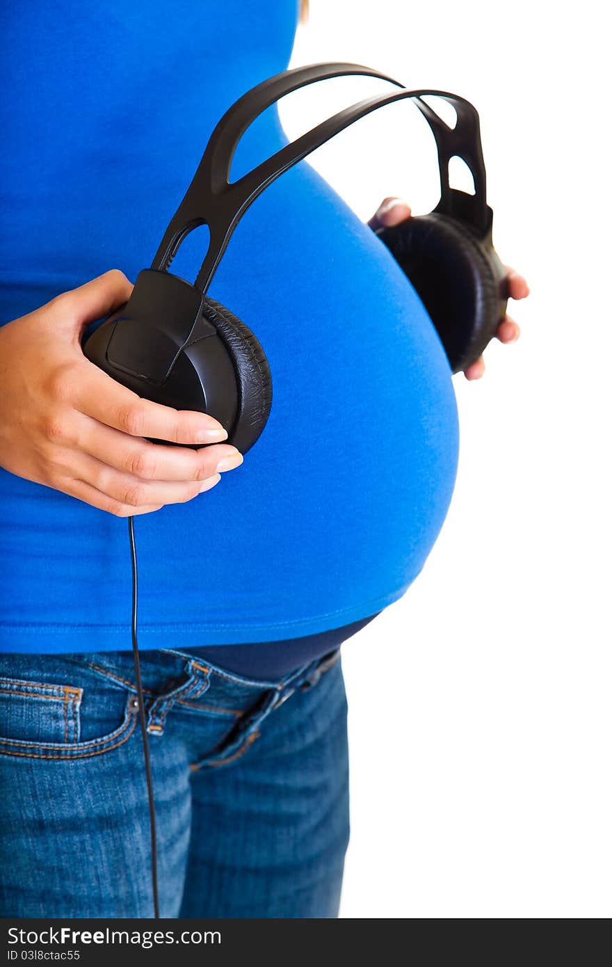 Pregnant woman with headphones