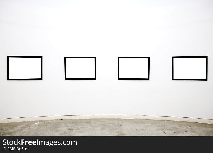 Empty frames on the wall of the gallery. Empty frames on the wall of the gallery