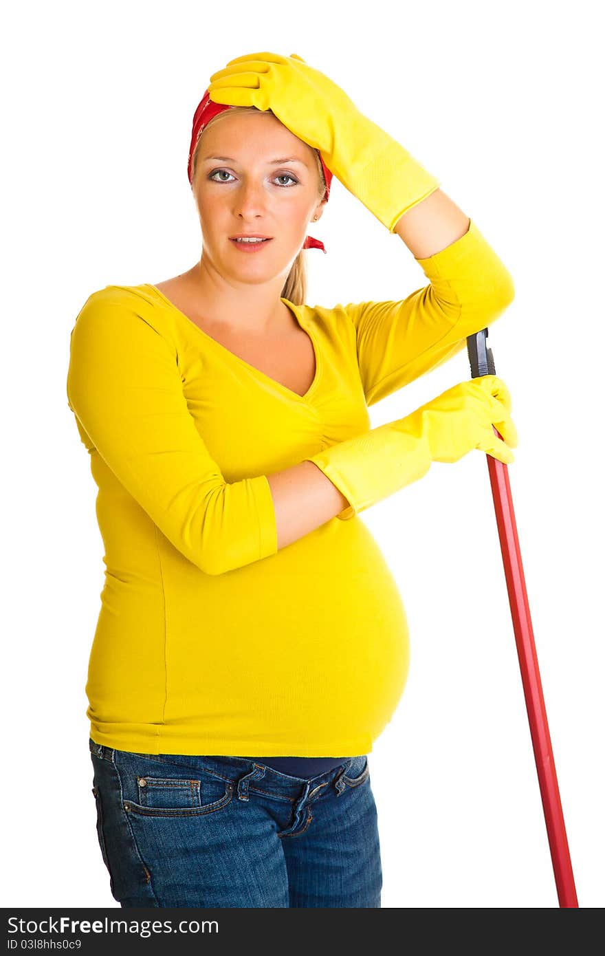 Tired pregnant woman cleaning