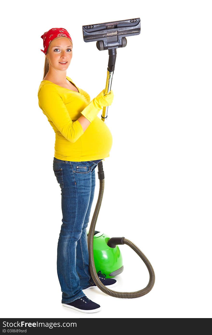 Pregnant woman clean with vacuum cleaner isolated on white