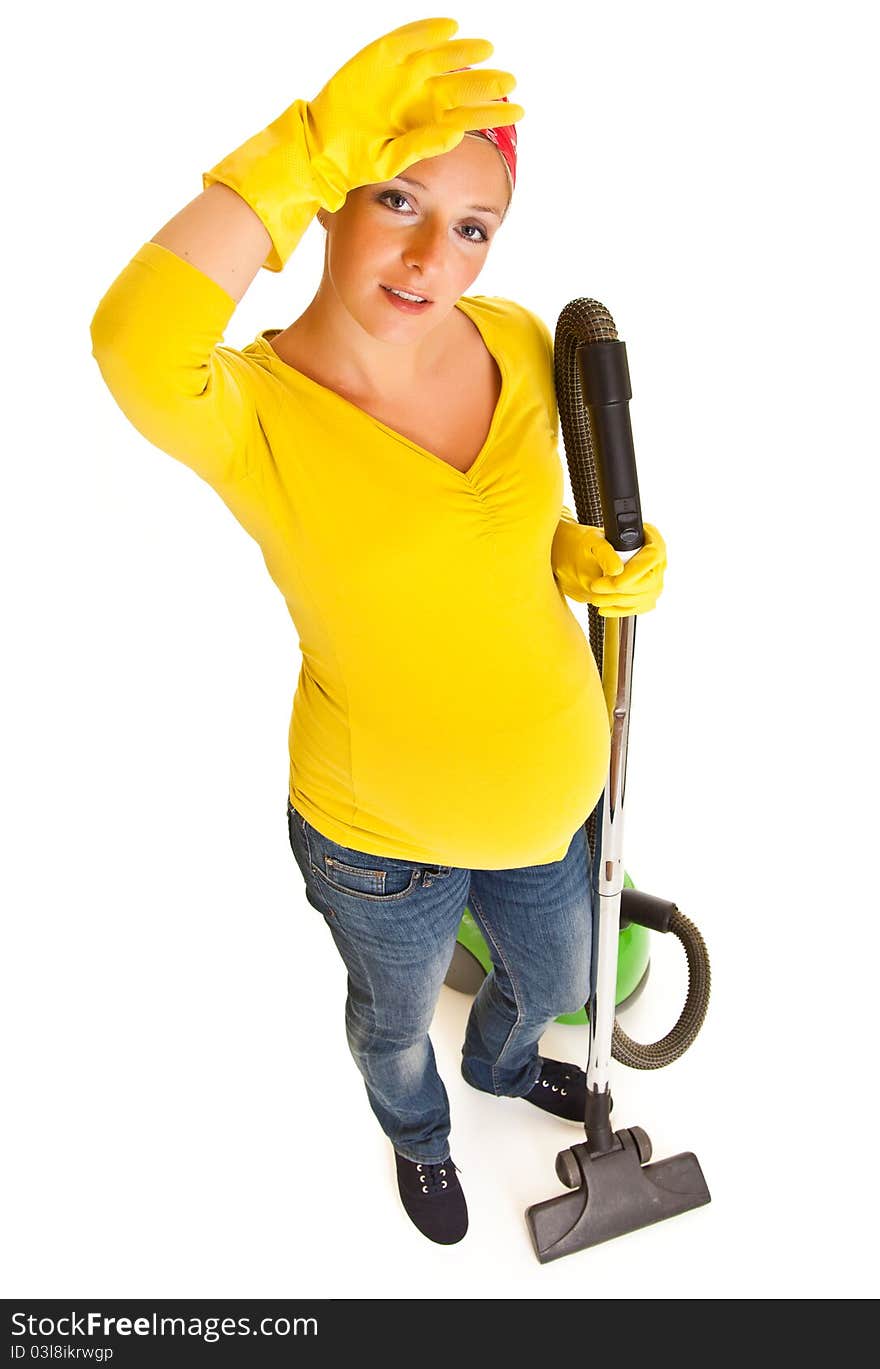 Pregnant woman clean with vacuum cleaner isolated on white