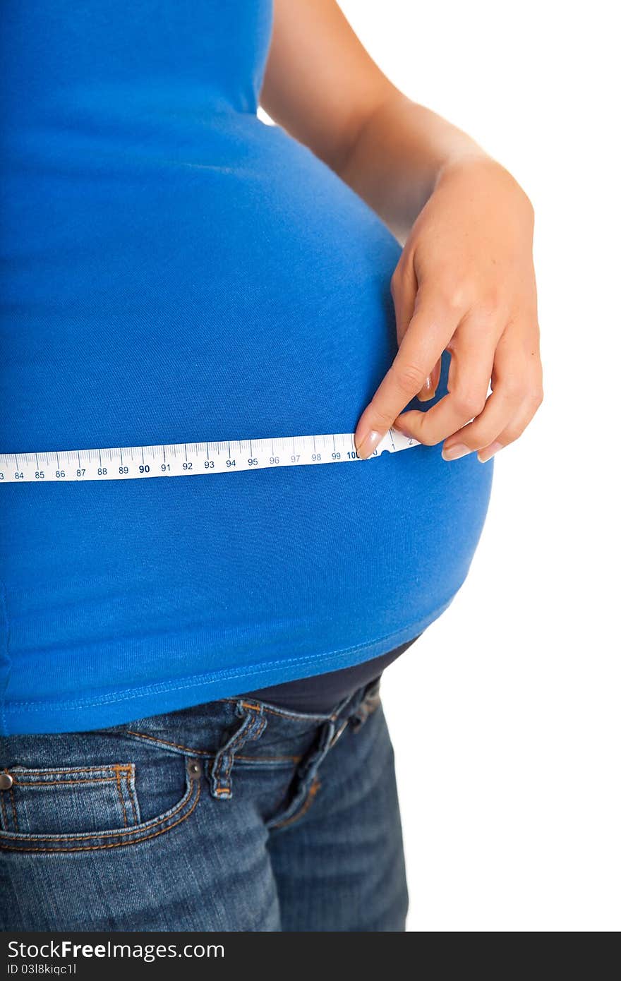 Pregnant woman measuring stomach