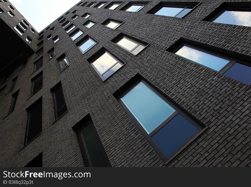 Looking up to dark facade of office building. Looking up to dark facade of office building