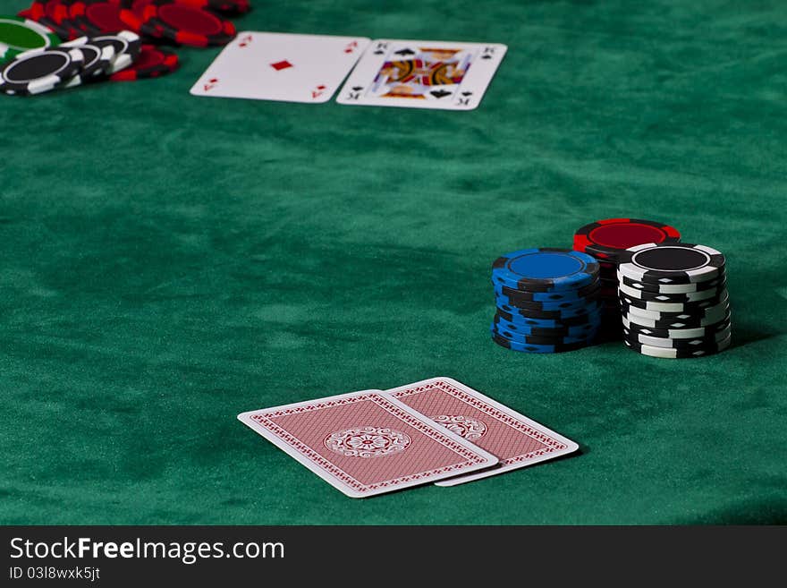 Cards and chips in a Texas hold 'em poker game.