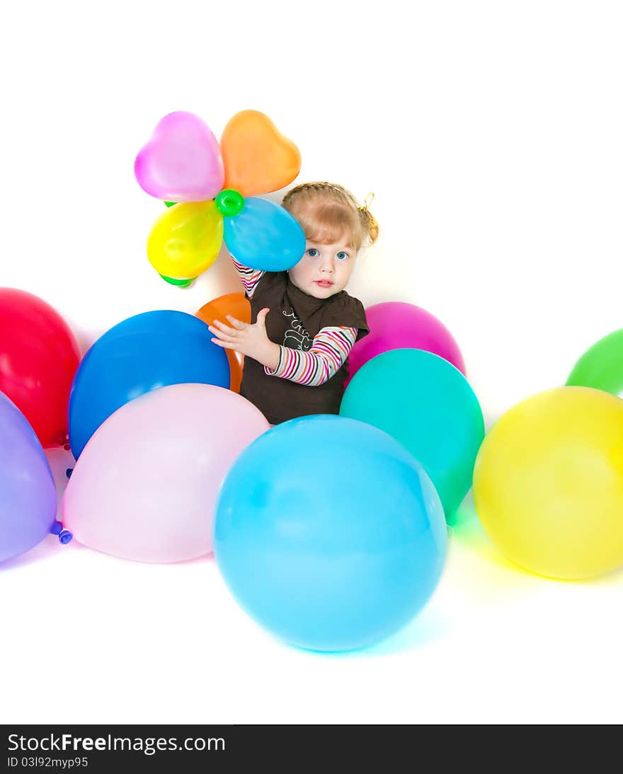 Little girl posing on front of camera with baloons. Little girl posing on front of camera with baloons