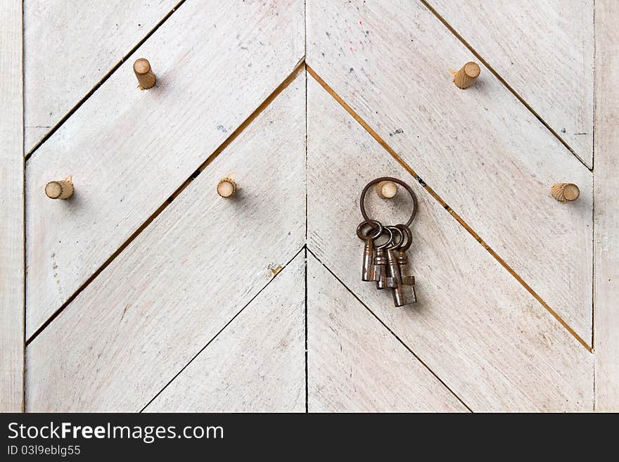 Set Of Keys On Wooden Wall