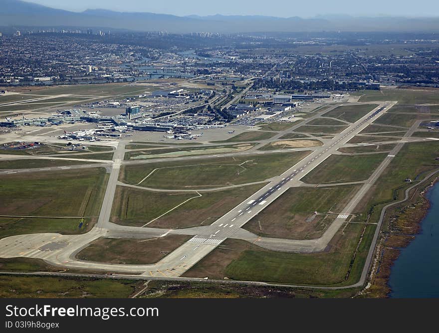 Vancouver Airport in Richmond and mountains. Vancouver Airport in Richmond and mountains