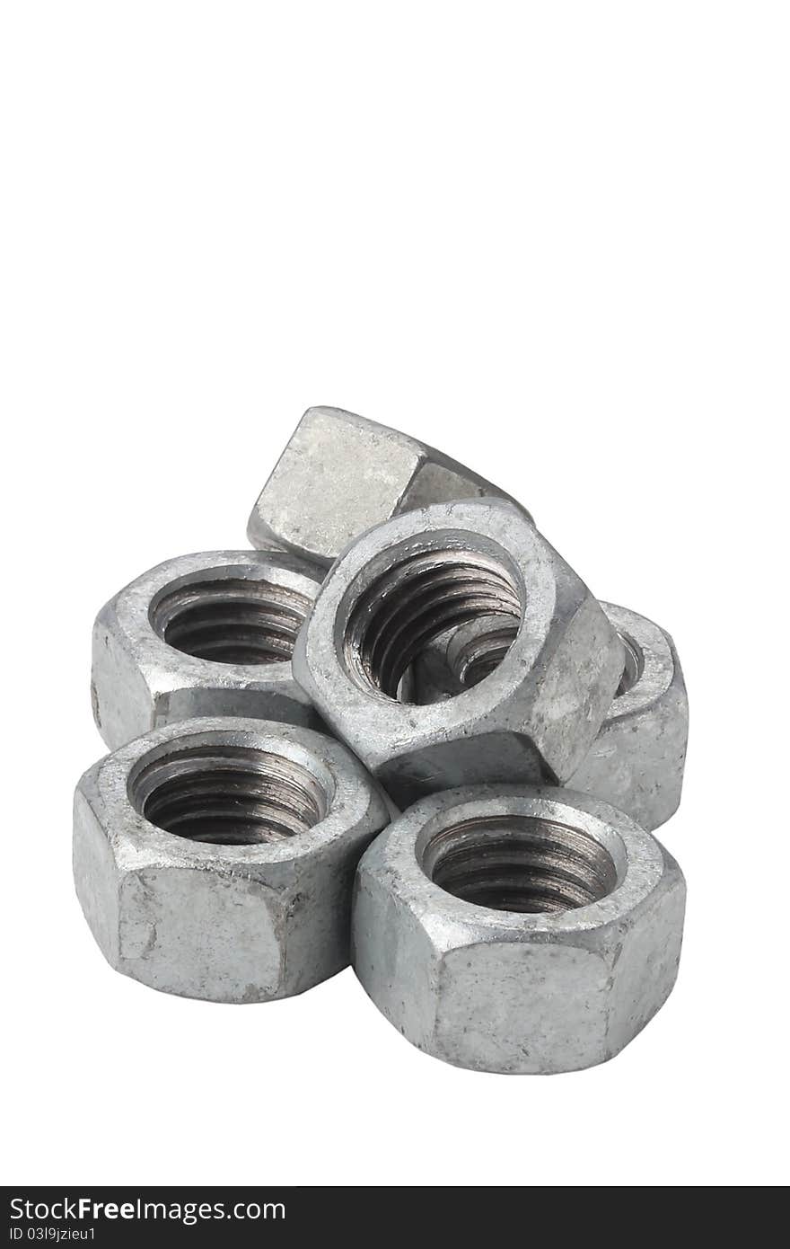 Silver metallic nuts isolated on a white background. Silver metallic nuts isolated on a white background.