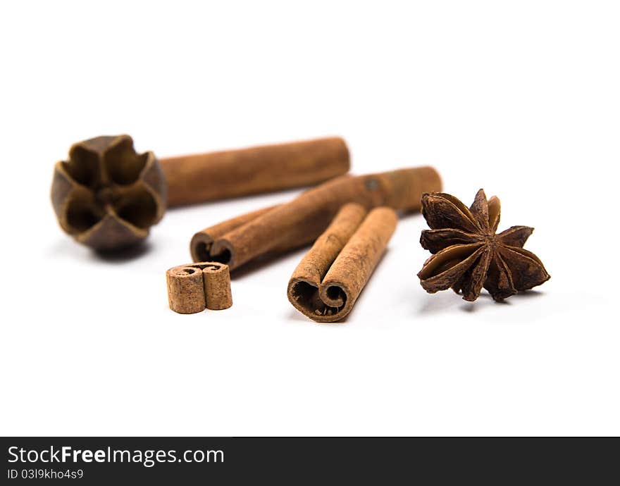 Star anise with cinnamon sticks isolated on white