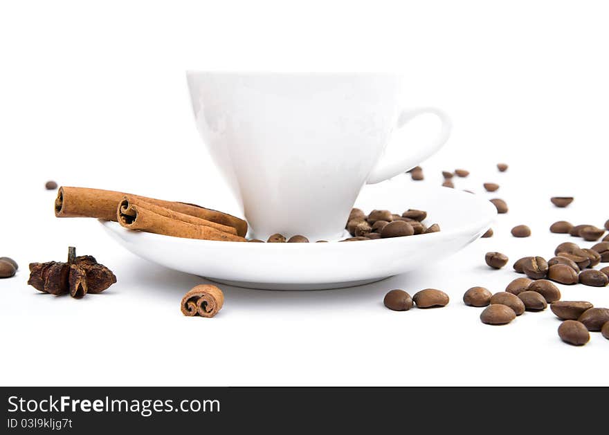 Cup of coffee and cinnamon bark on a white background. Cup of coffee and cinnamon bark on a white background