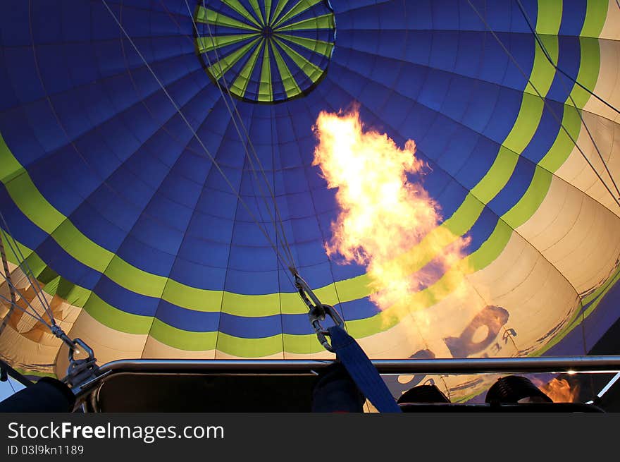 Hot air balloon with bright burning gas flame