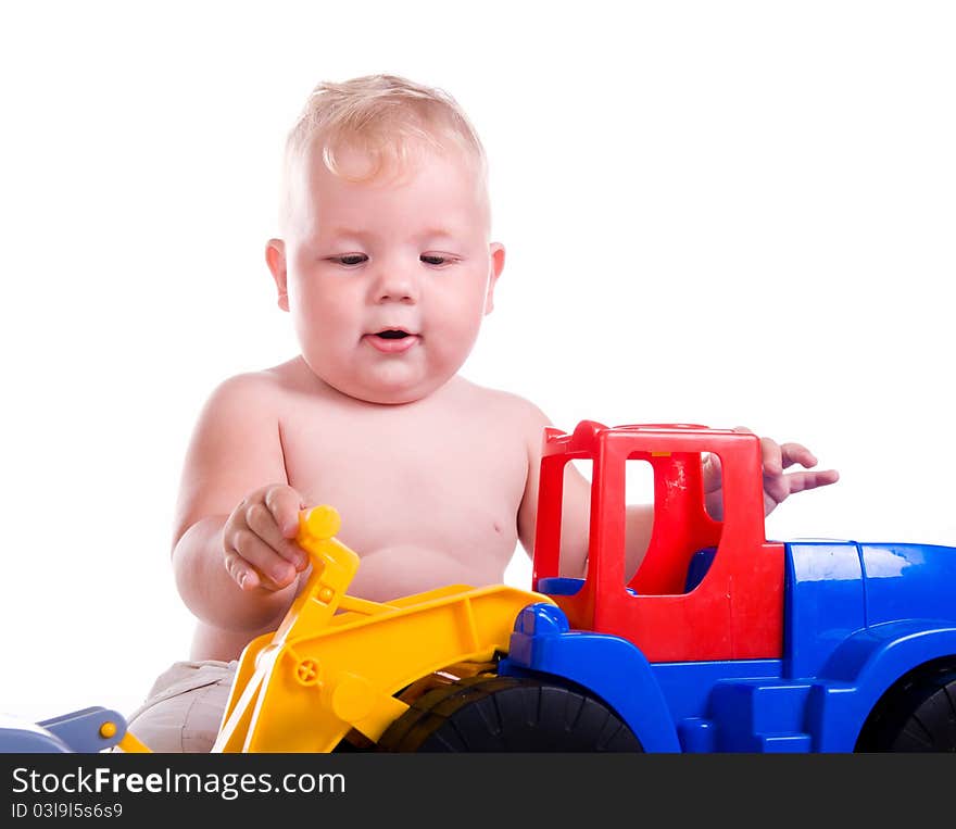 Little boy  with a big car on white background