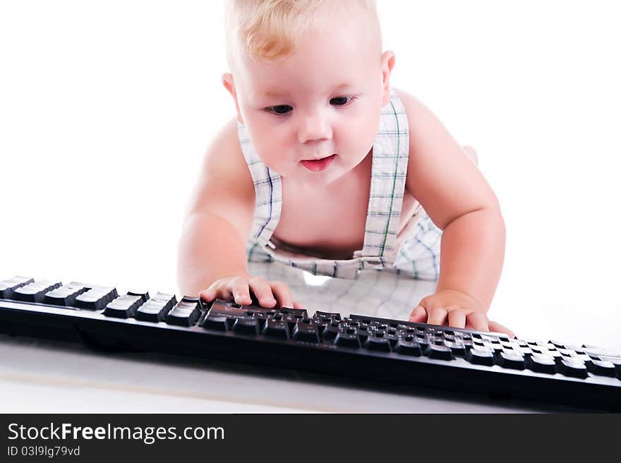 Little child holding keyboard isolated over white