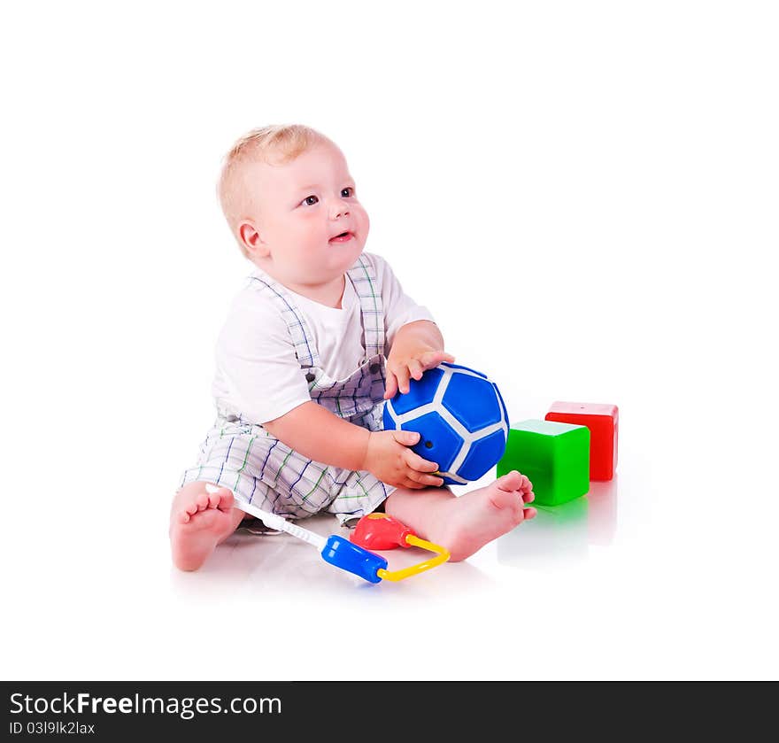 Little boy with a toys on white background