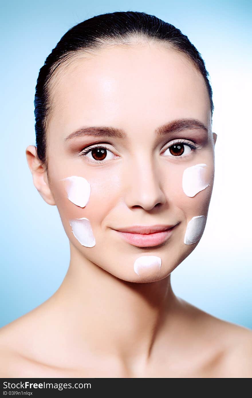 Portrait of beautiful spa girl with cream on her face. Portrait of beautiful spa girl with cream on her face.