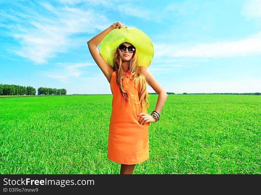 Beautiful young woman in a hat outdoors. Beautiful young woman in a hat outdoors.