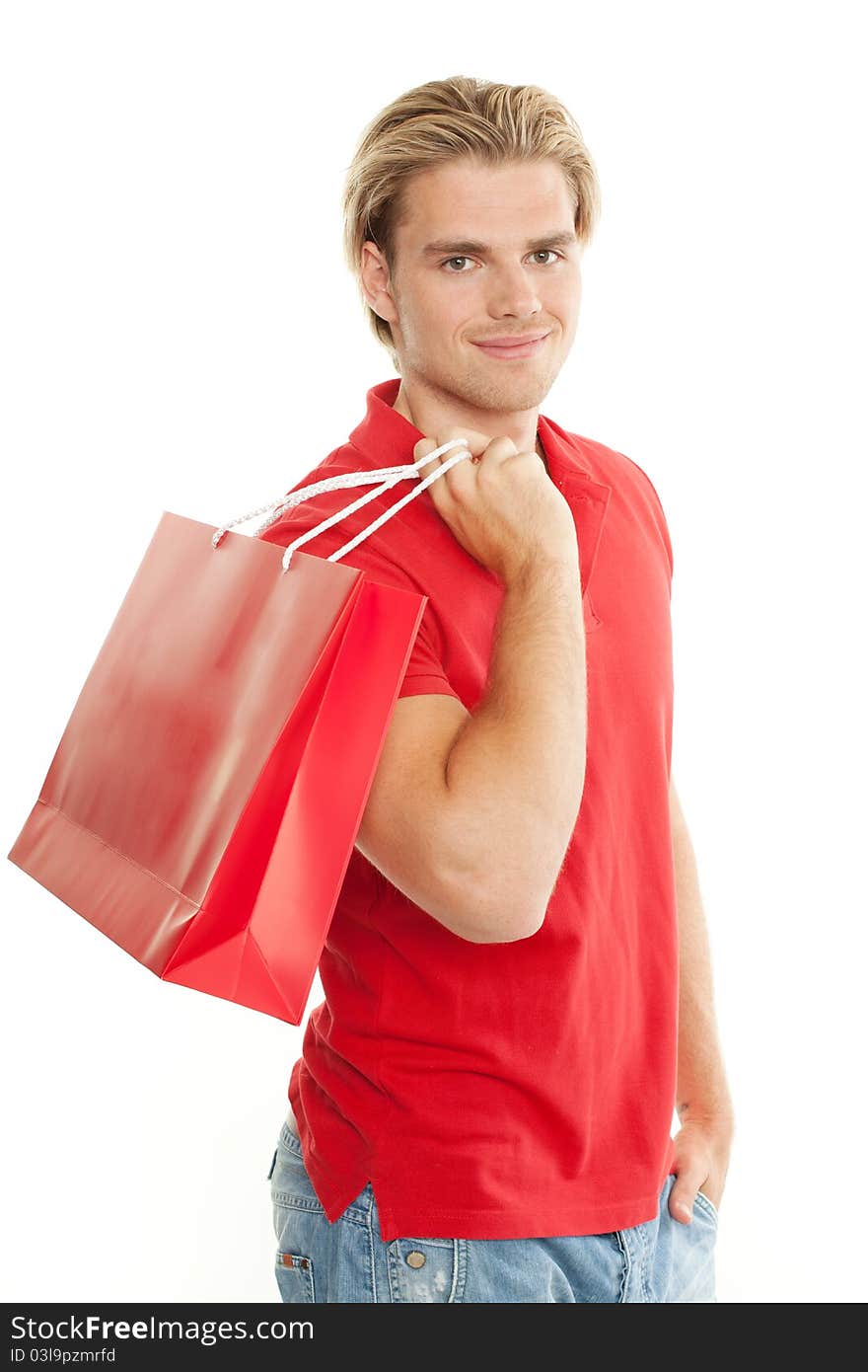 Man is holding a bag over his shoulder. Man is holding a bag over his shoulder