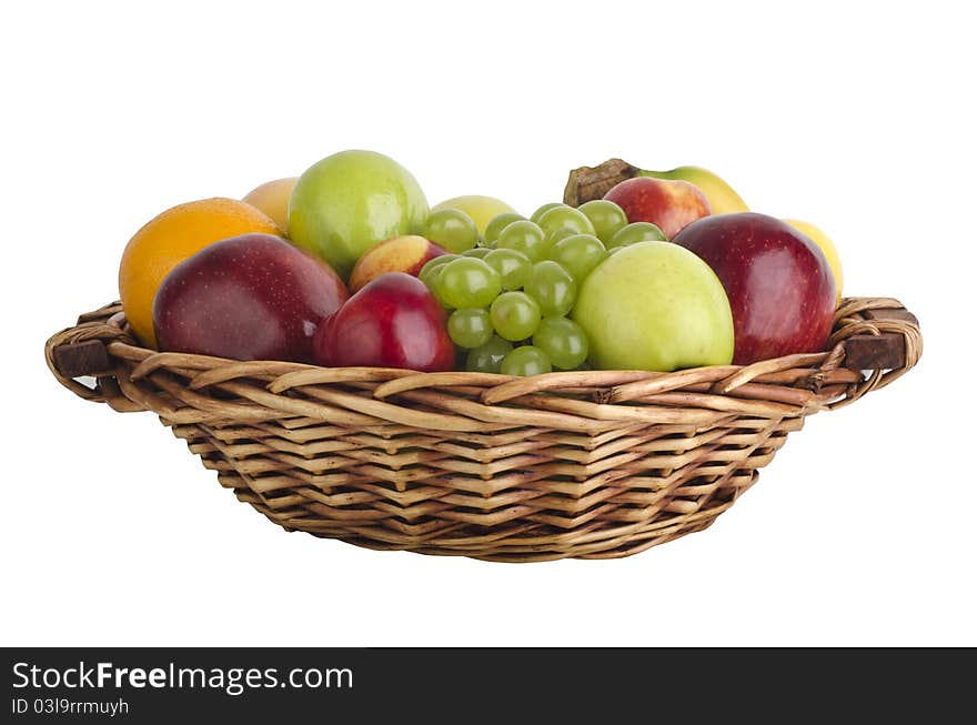 Various fruits in a wooden basket, isolated on white. Various fruits in a wooden basket, isolated on white.