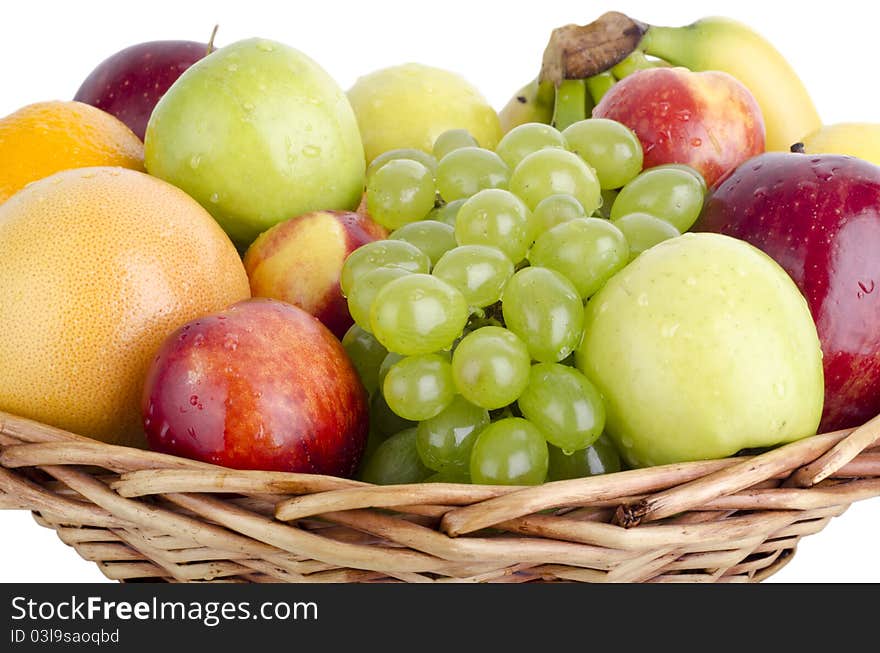 Various fruits in a wooden basket, isolated on white. Various fruits in a wooden basket, isolated on white.