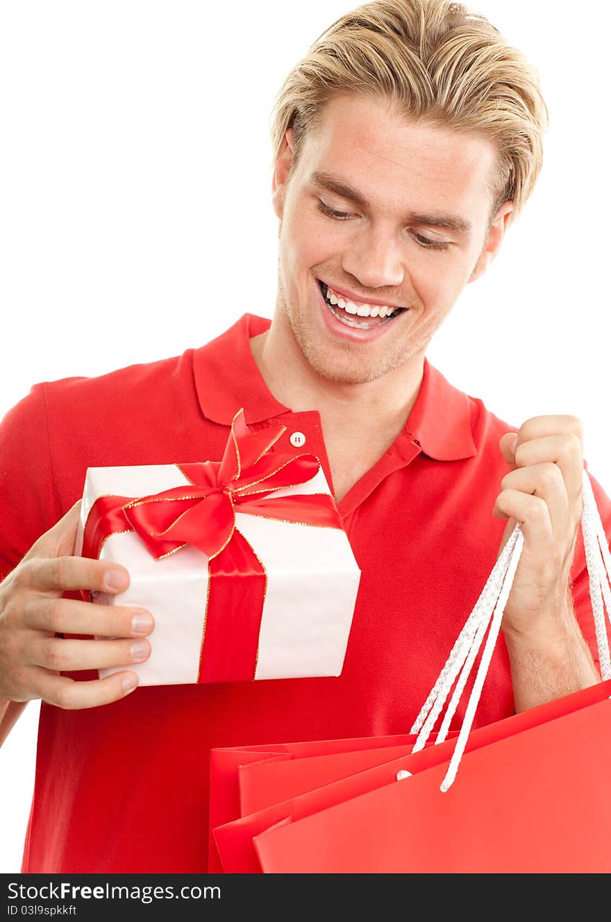 Young man is surprised about a gift. Young man is surprised about a gift