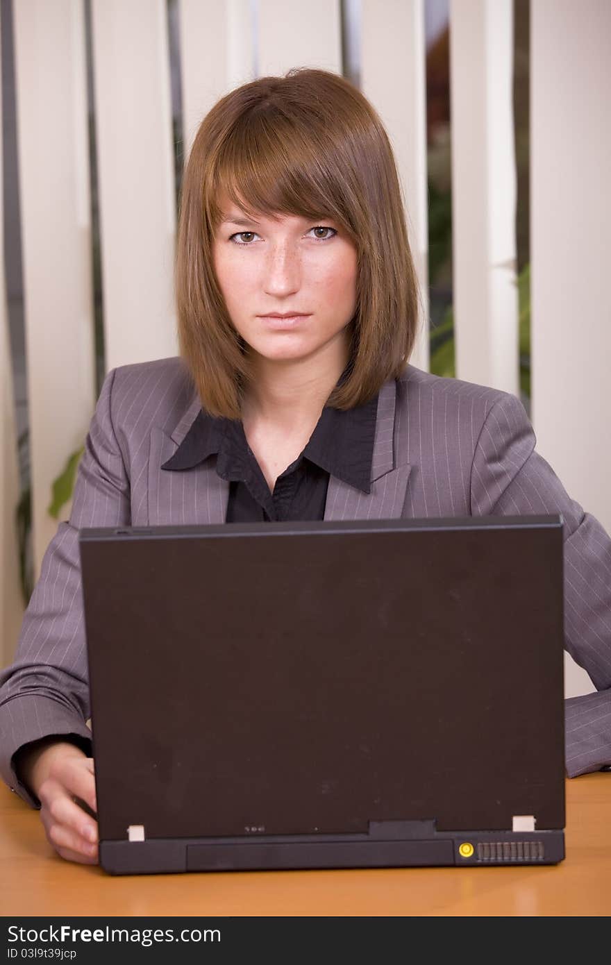 Portrait of female secretary by office work