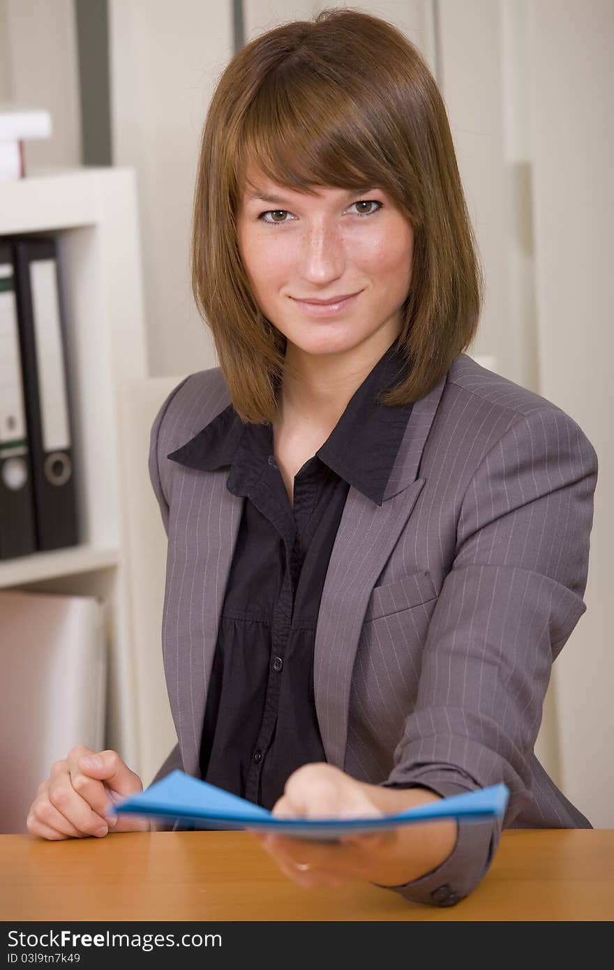 Woman in business suit giving job application