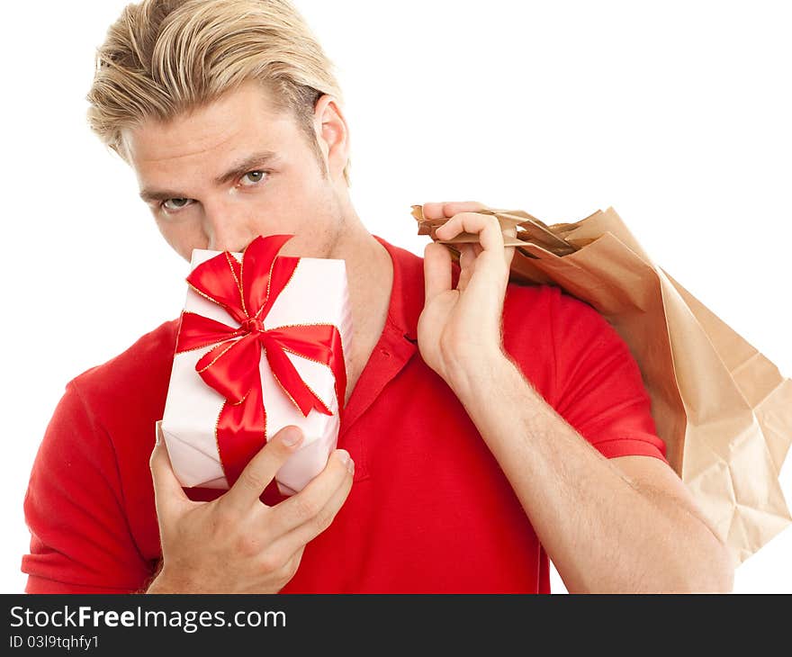 Young blond man with gift and bag. Young blond man with gift and bag