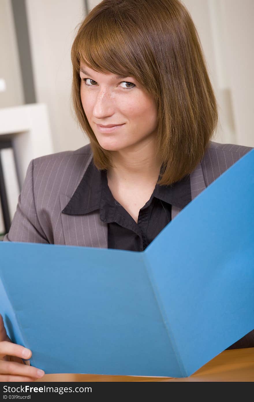 Woman reading application file