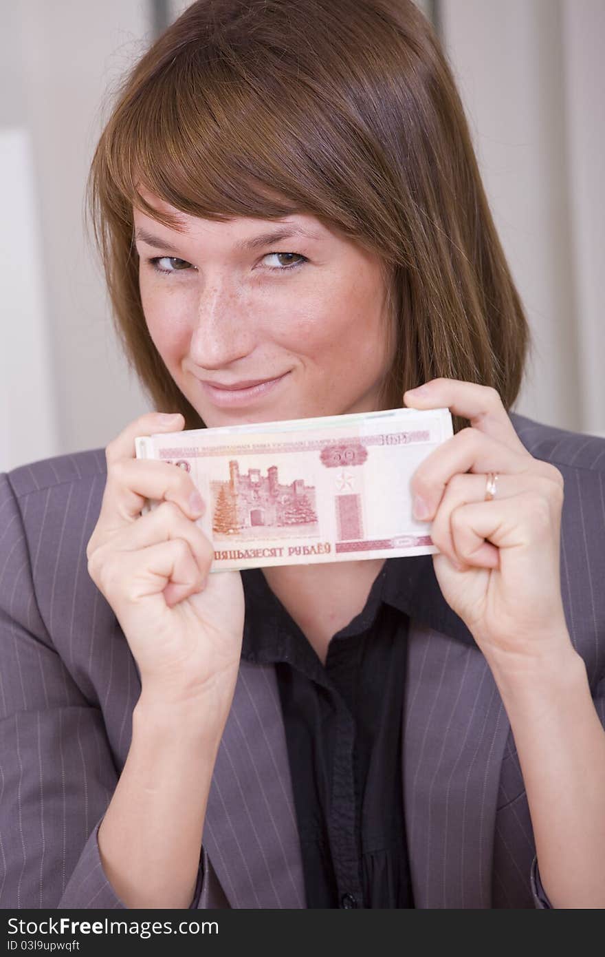 Happy business woman holding russian money. Happy business woman holding russian money