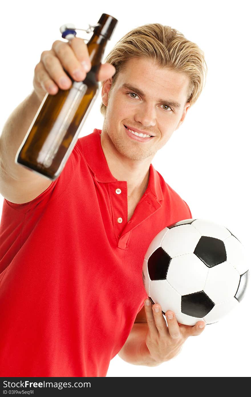 With beer and soccer smiling in the camera. With beer and soccer smiling in the camera