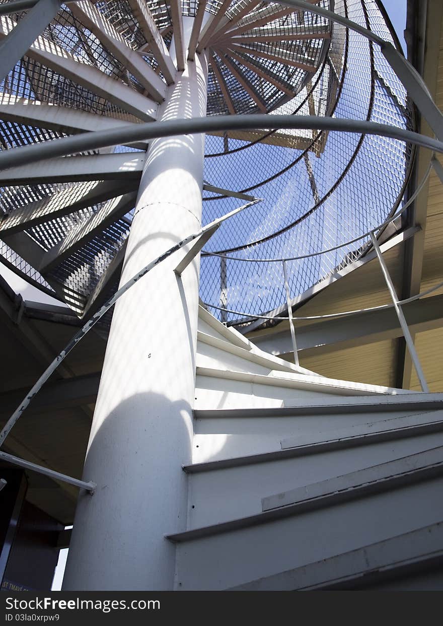 Spiral staircase with blue sky