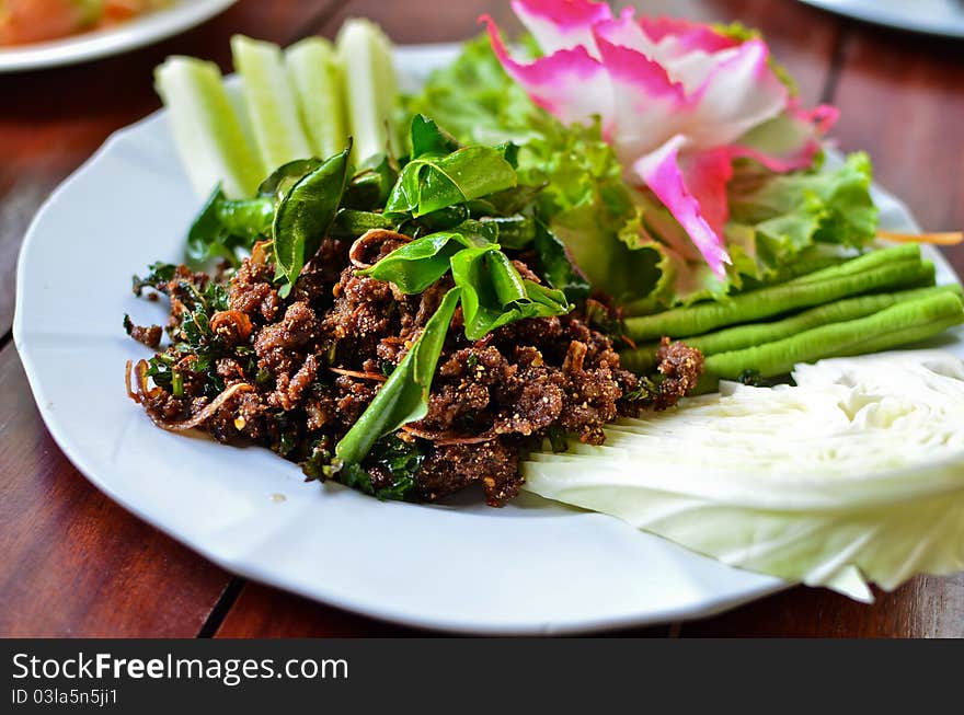 Spicy fried pork with vegetables , Thai style food