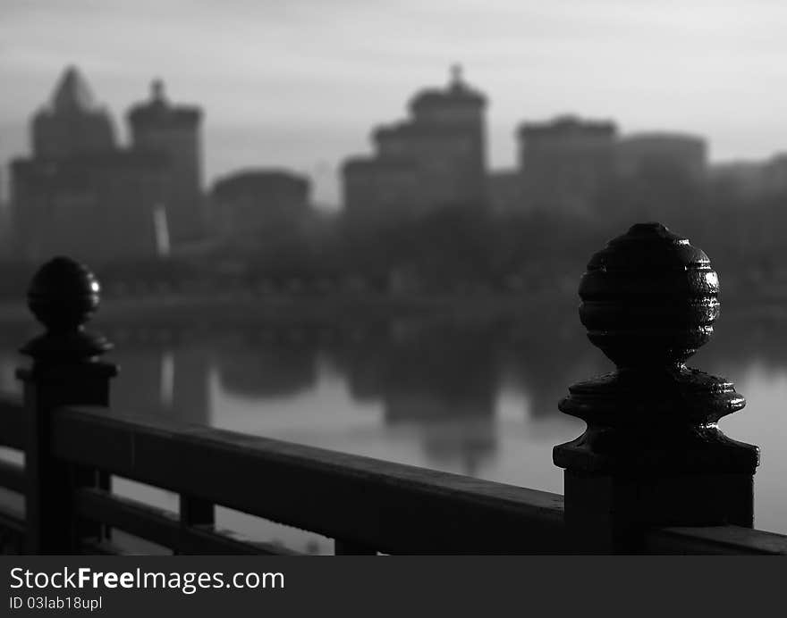 Black and white photo of the element iron fence standing on the quay. Association with the reliability. Black and white photo of the element iron fence standing on the quay. Association with the reliability