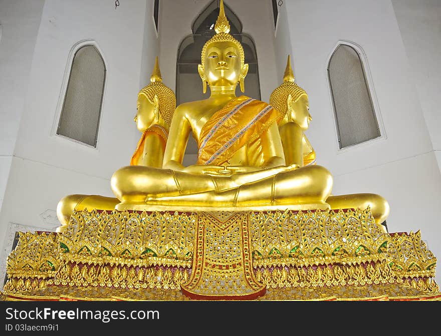 Statue of Buddha sit on the haunches in Thailand