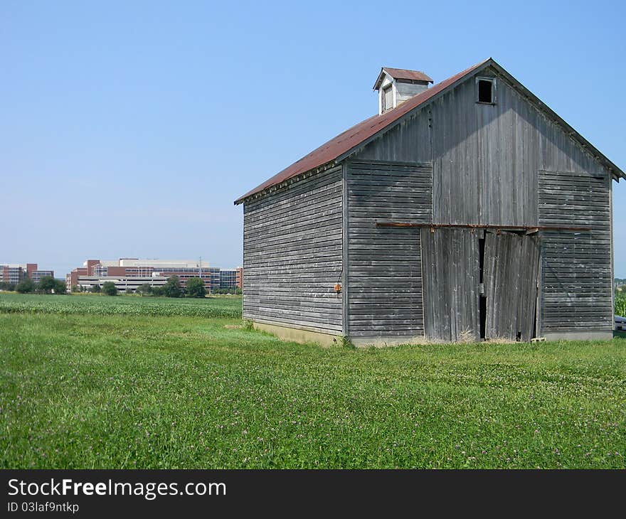 This old corn crib with the new building behind shows the encroachment of the new upon the old. The competition for the land.