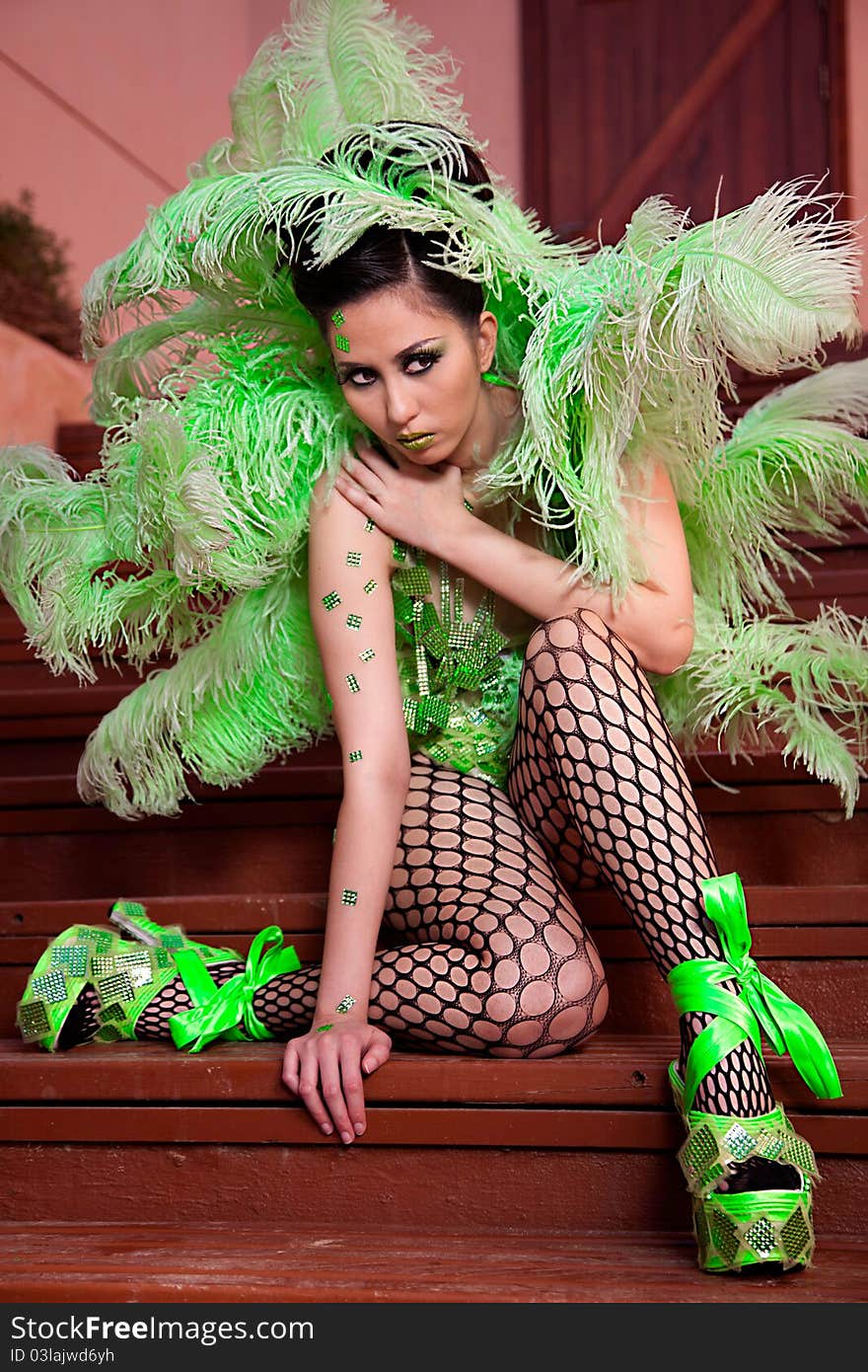 Female wearing green feather fashion