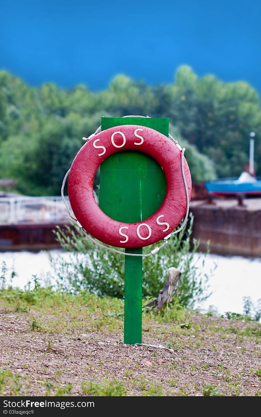 Red life preserver on the green column