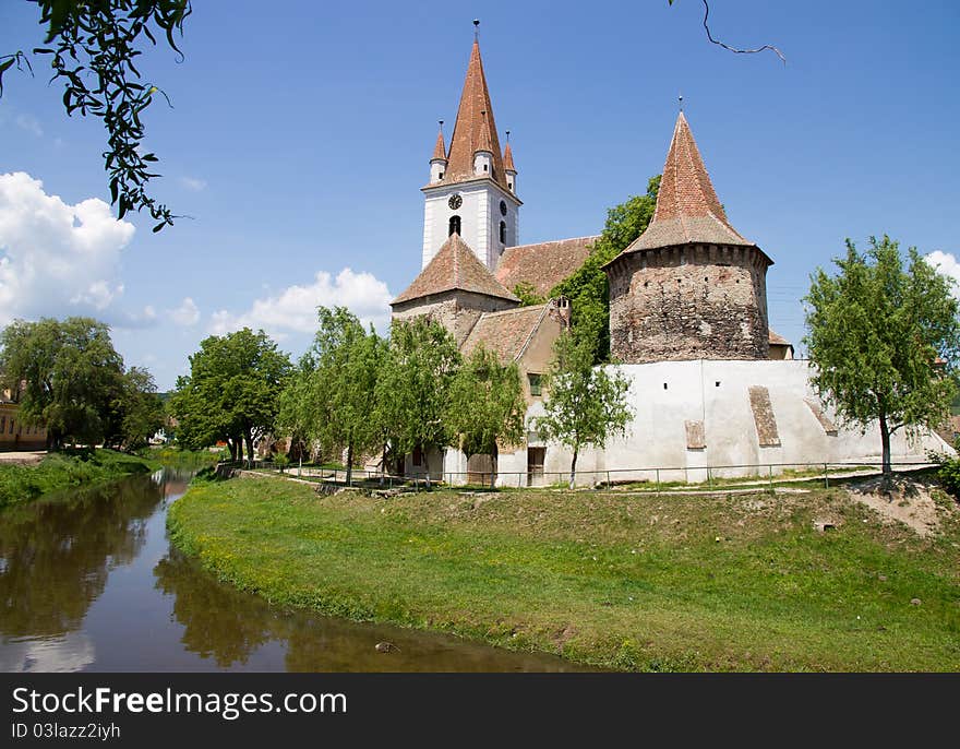 Castle near a river in the mountains