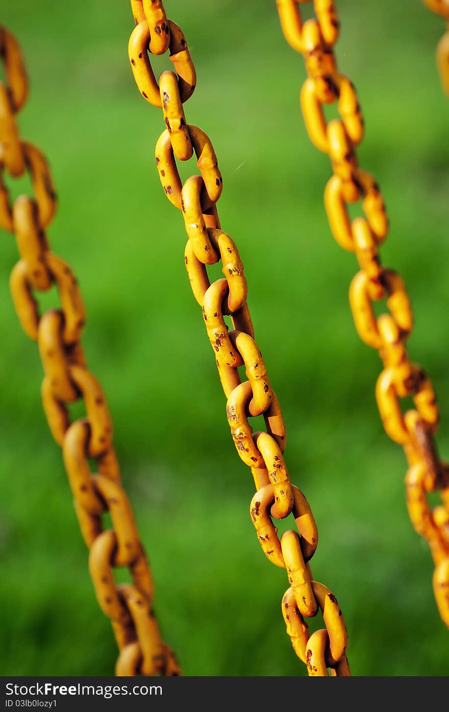 The yellow chains on the green blackgruond